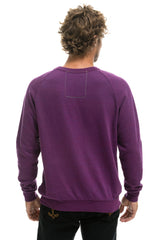 NEVER STOP CHASING RAINBOWS CREW SWEATSHIRT - PURPLE